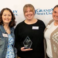 Group of three women with an award